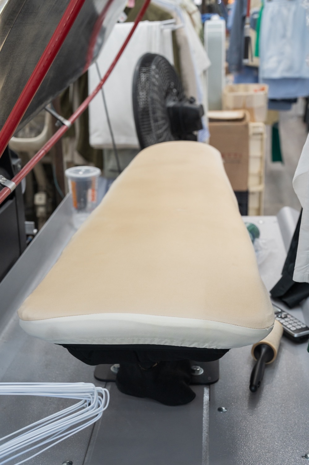 A garment finished by hand on the pressing station at Kim's Valet Cleaners